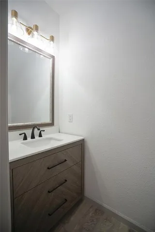 a view of a livingroom with a ceiling fan and window