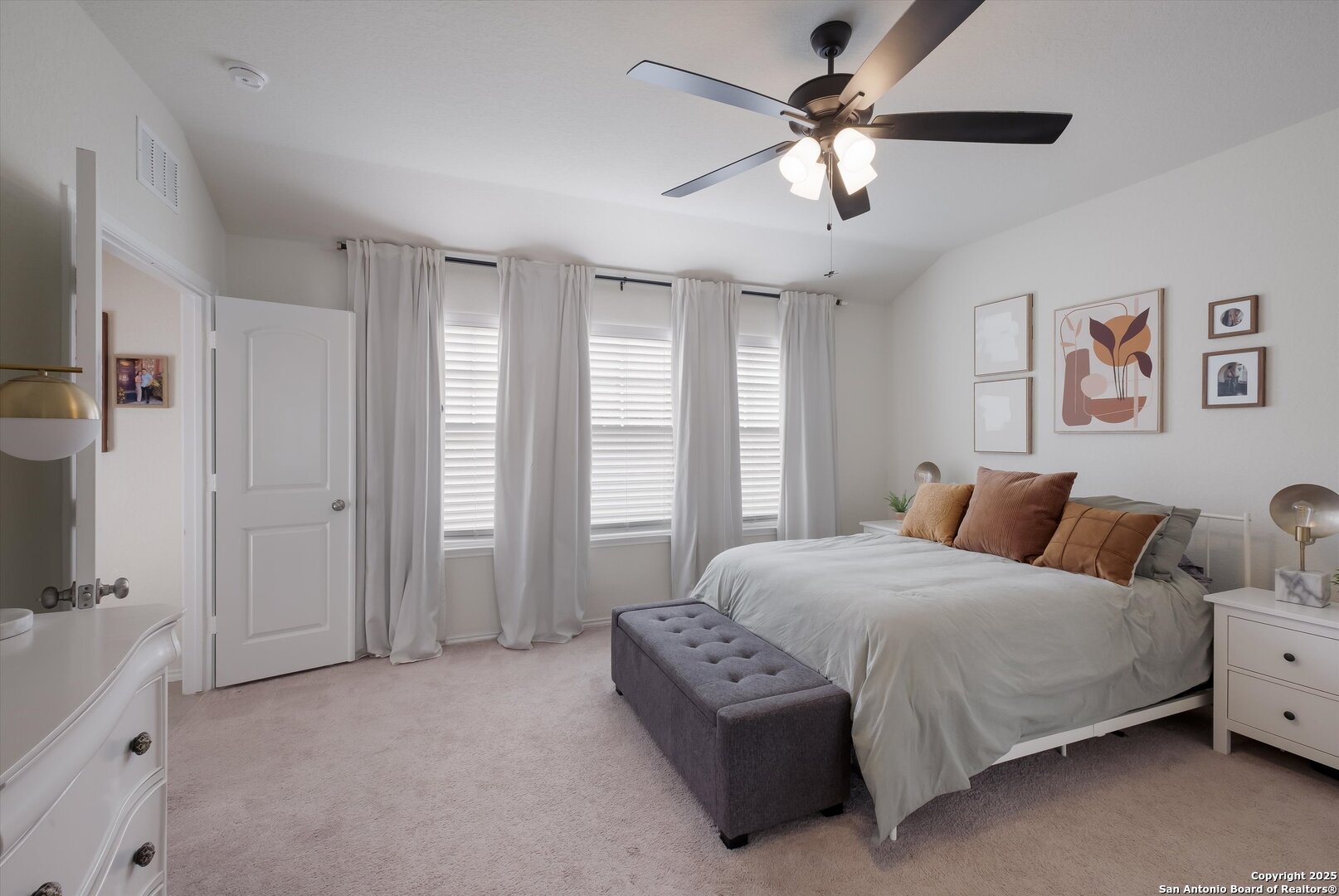 9029 Curling Post Schertz, TX 78154 - Photo 17 of 53 a bedroom with a bed ceiling fan and a window