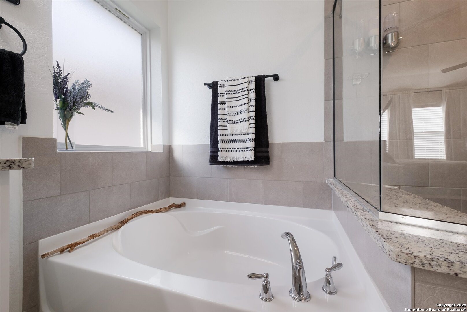 9029 Curling Post Schertz, TX 78154 - Photo 19 of 53 a bathroom with a bathtub and a shower