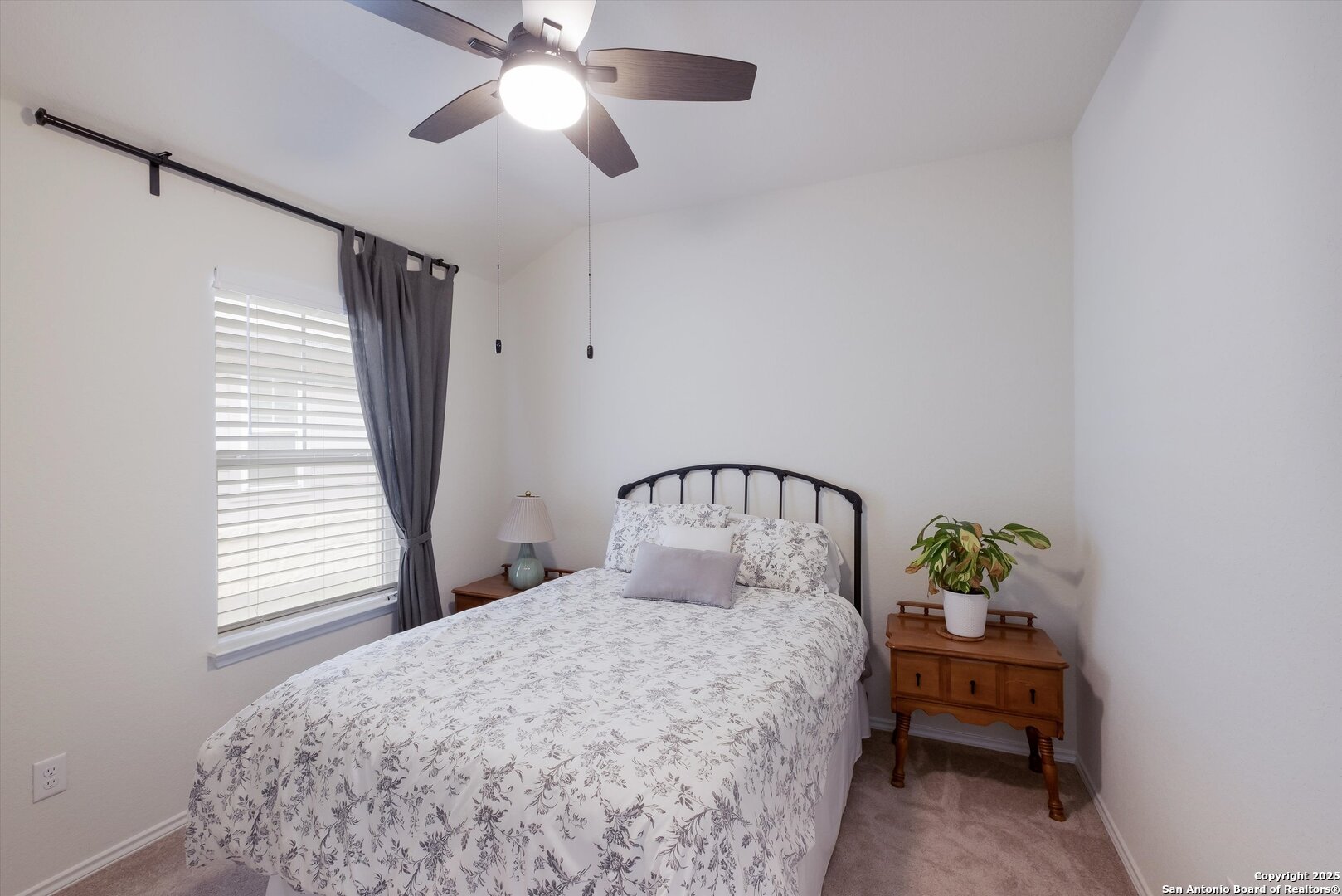 9029 Curling Post Schertz, TX 78154 - Photo 26 of 53 a bedroom with a bed and a chandelier