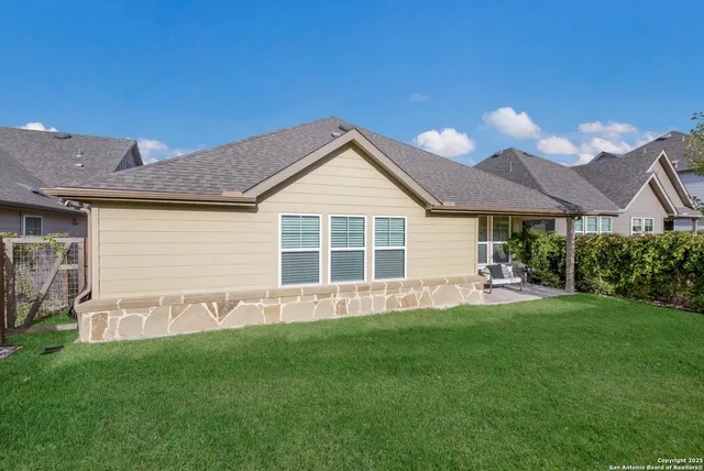 a front view of a house with a yard and porch