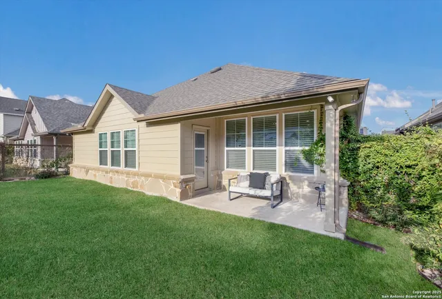 a view of a house with a backyard