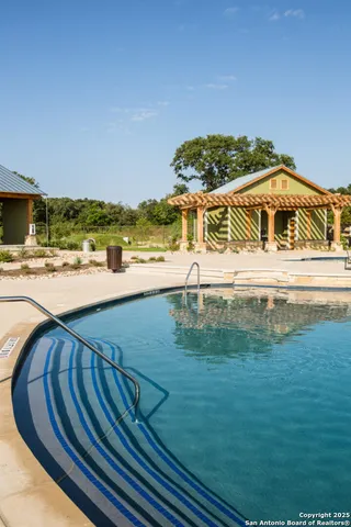 a view of a swimming pool with an ocean view