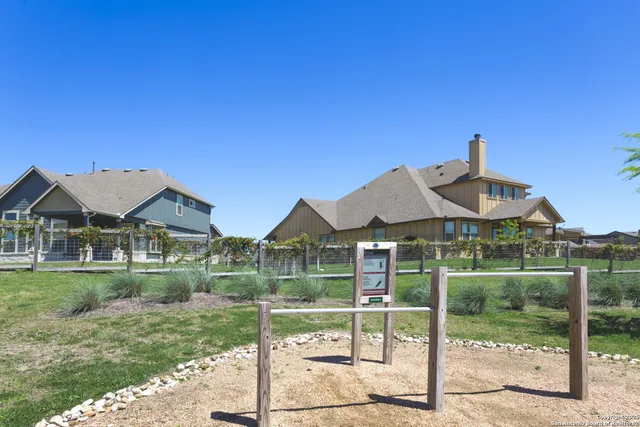 a view of a lake with houses in the back