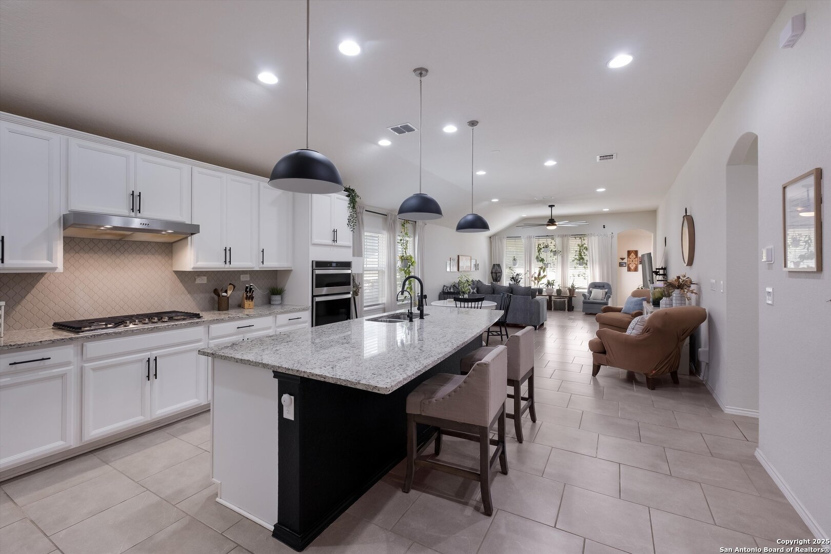 9029 Curling Post Schertz, TX 78154 - Photo 6 of 53 a kitchen with stainless steel appliances granite countertop a sink a stove a refrigerator and a oven