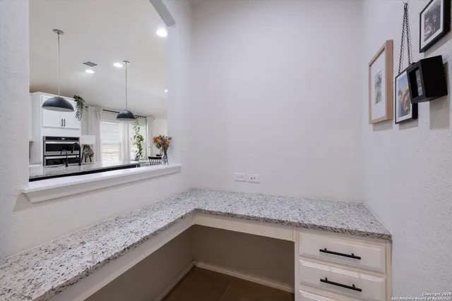 a view of kitchen and microwave