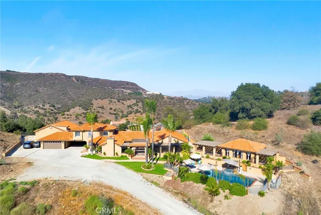 an aerial view of a house with a garden