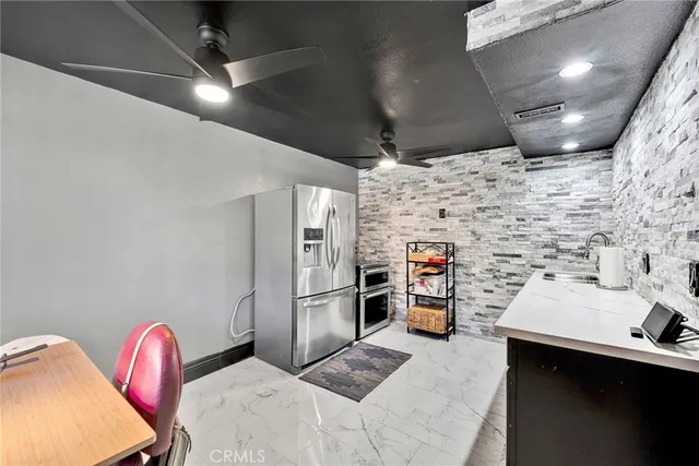 an aerial view of mountain with residential space and mountain view in back