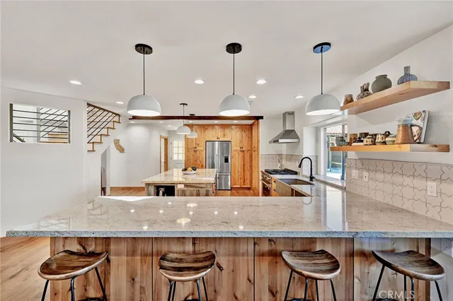 a bathroom with a sink a mirror and shower