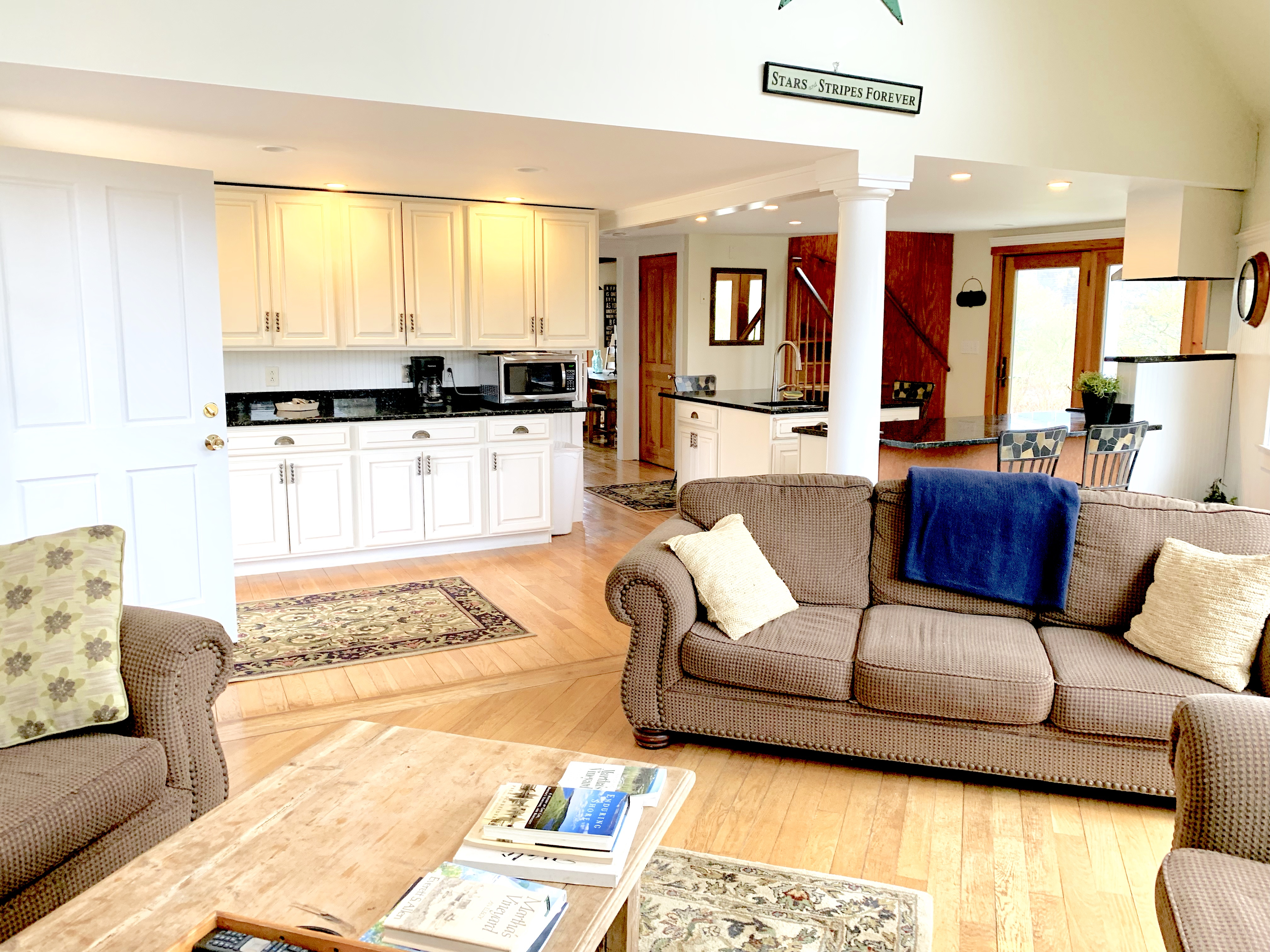 650 Lighthouse Road Aquinnah, MA 02535 - Photo 10 of 57 Living room airy and bright open to the kitchen, so you're never cut off from the action!