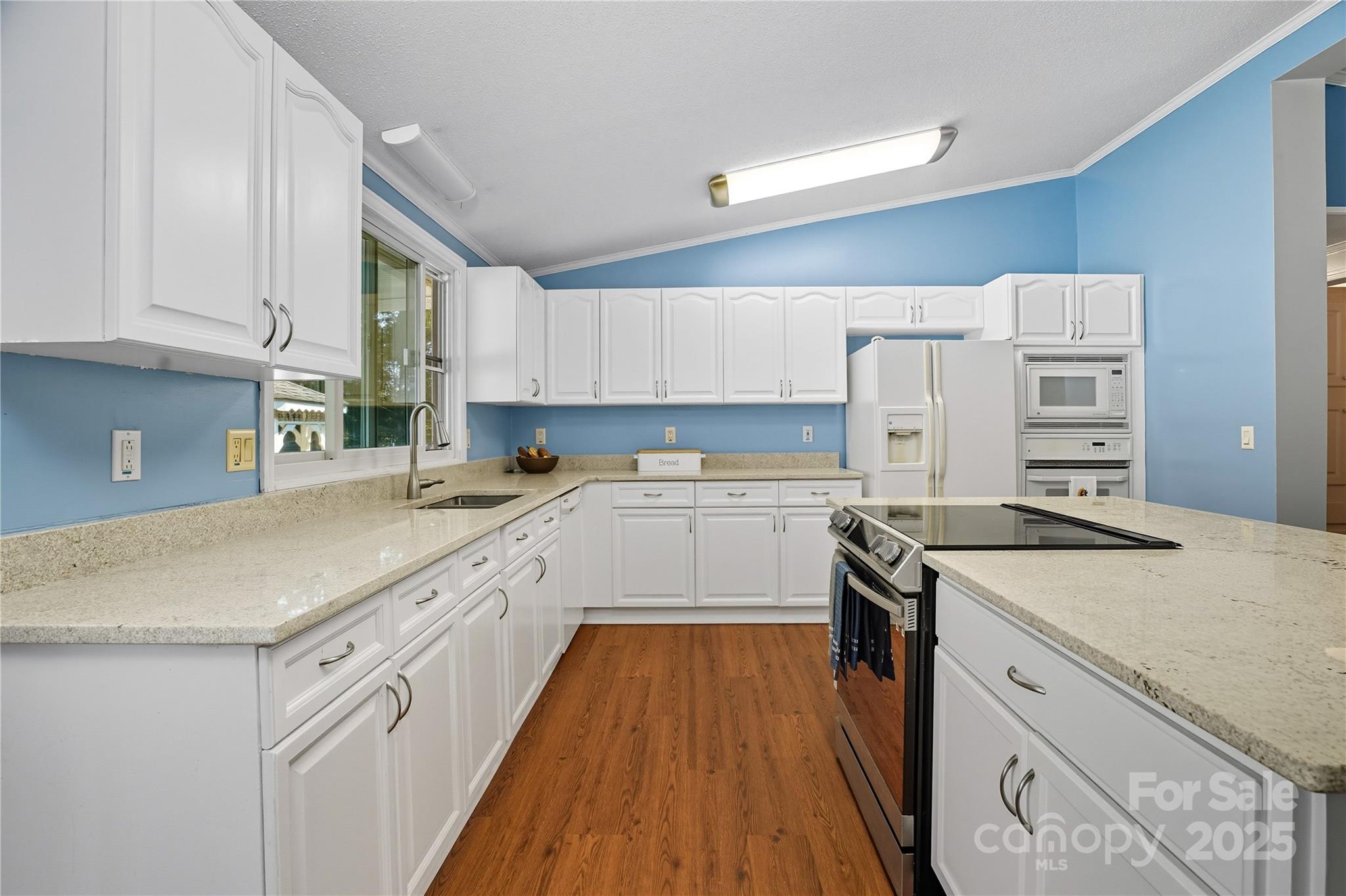 1660 Lentz Road China Grove, NC 28023 - Photo 13 of 44 a kitchen with a stove a sink and a refrigerator