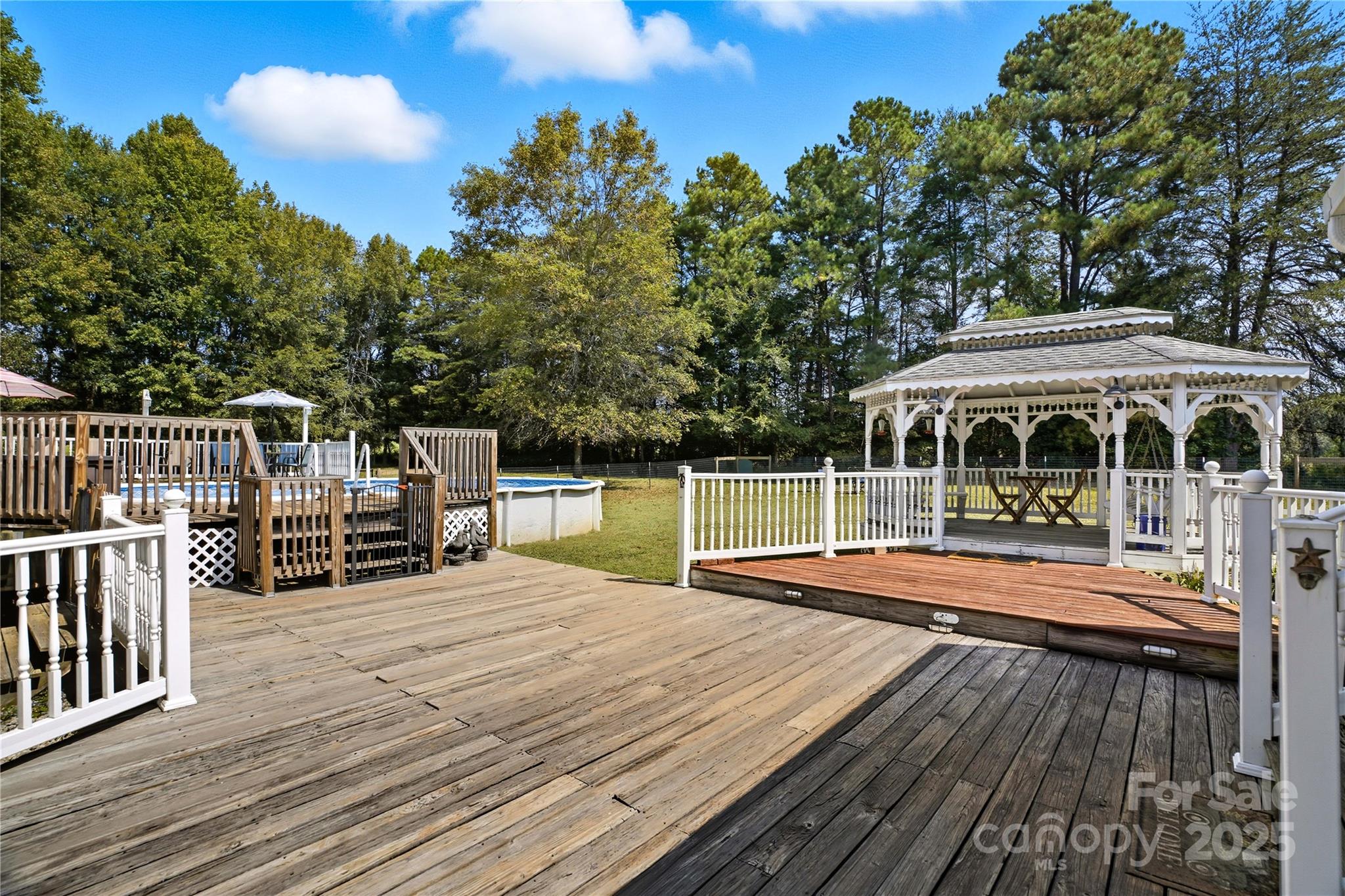 1660 Lentz Road China Grove, NC 28023 - Photo 30 of 44 a view of house with swimming pool and sitting area