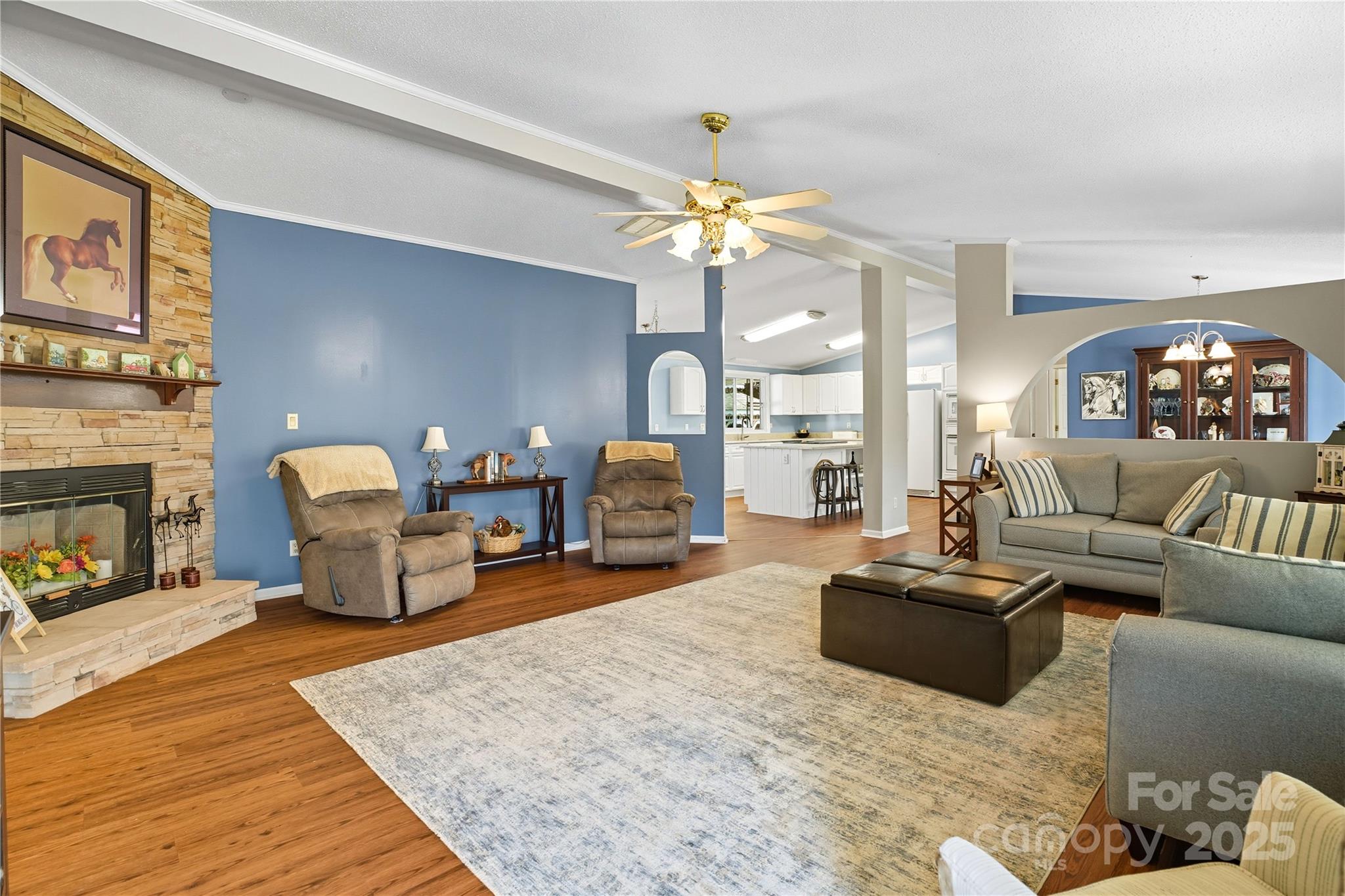 1660 Lentz Road China Grove, NC 28023 - Photo 10 of 44 a living room with furniture a fireplace and a chandelier