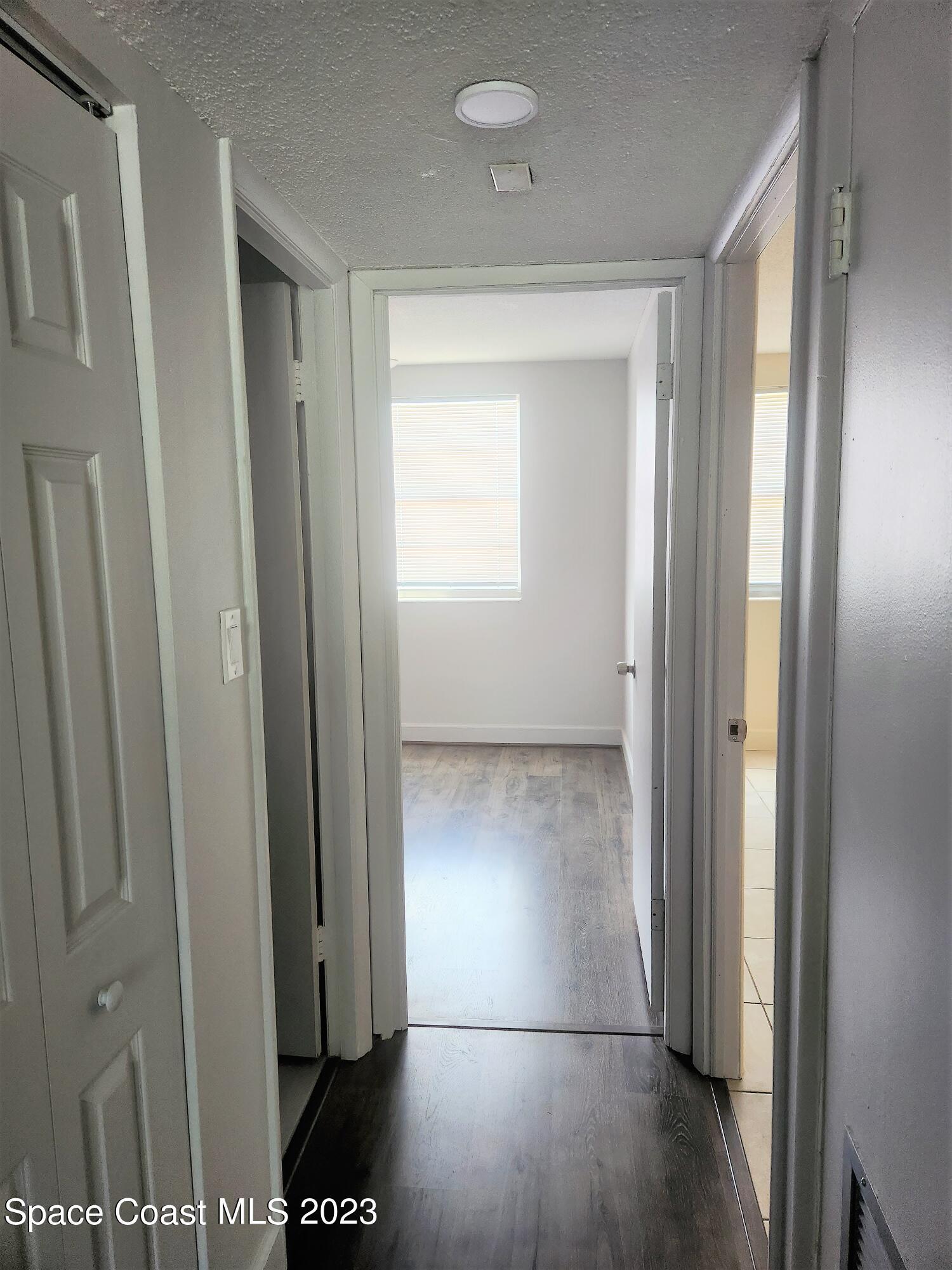 8401 North Atlantic Avenue, Unit K9 Cape Canaveral, FL 32920 - Photo 7 of 14 a view of a hallway