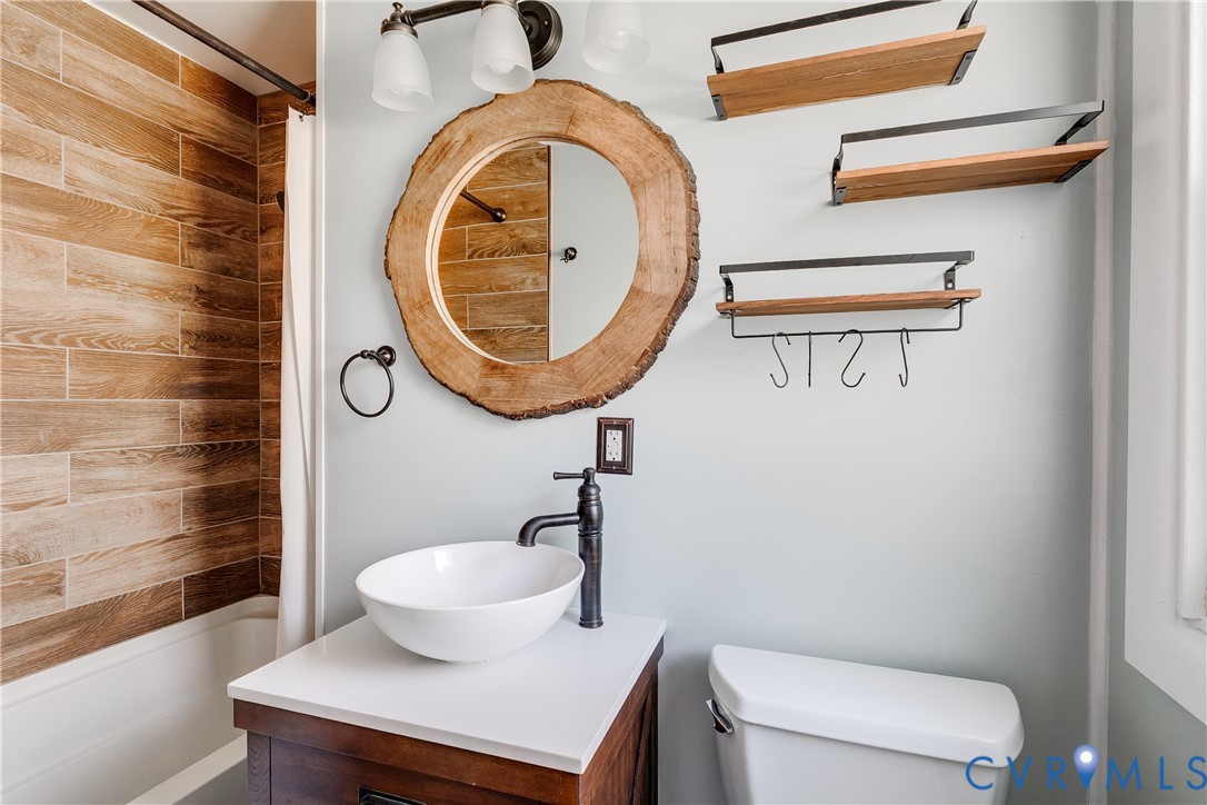 1180 Berryhill Road Henrico, VA 23231 - Photo 11 of 23 a bathroom with a toilet and a sink