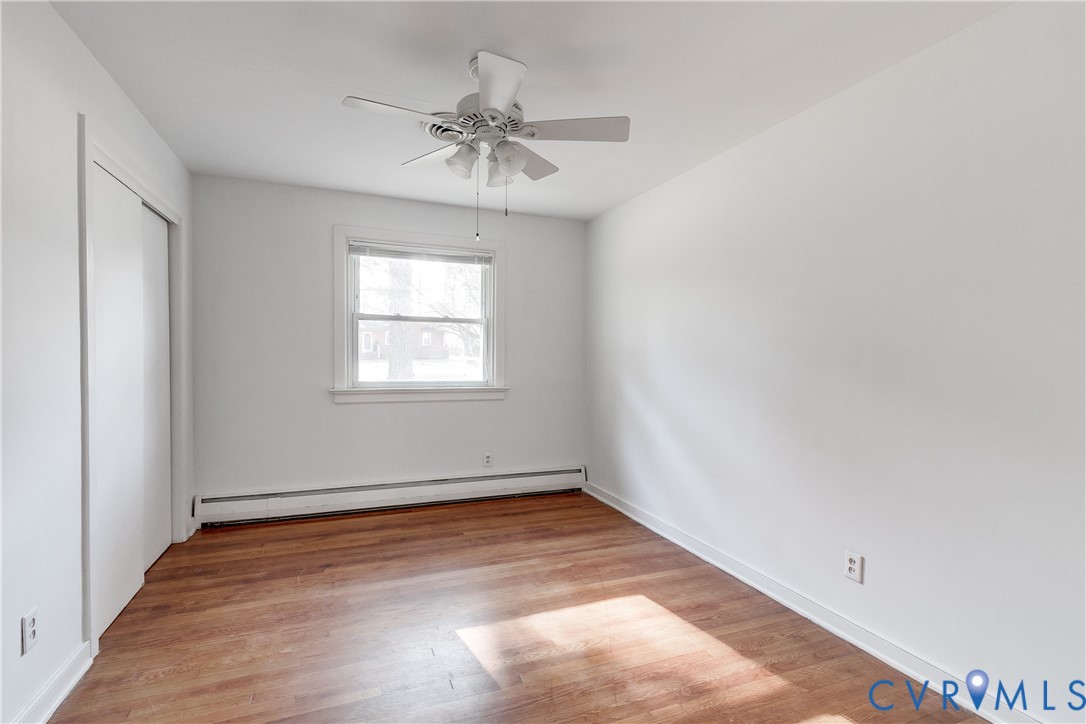 1180 Berryhill Road Henrico, VA 23231 - Photo 13 of 23 wooden floor in an empty room with a window