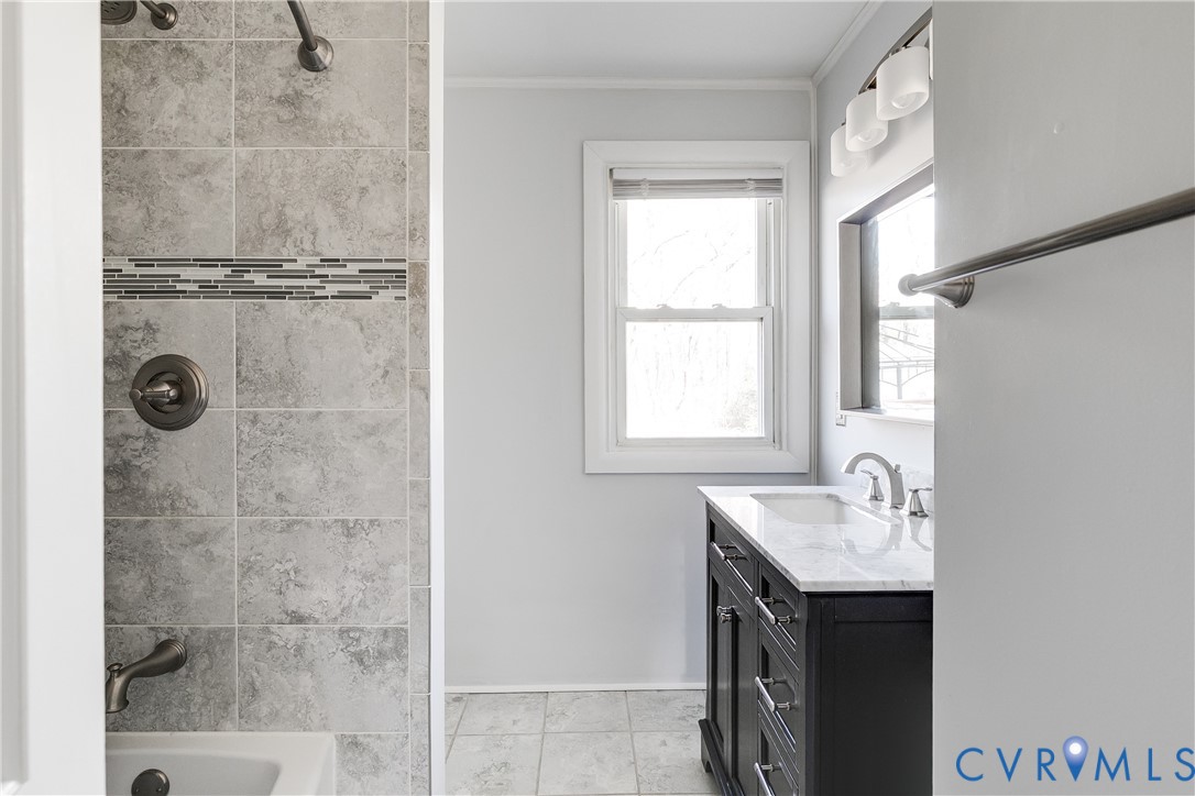 1180 Berryhill Road Henrico, VA 23231 - Photo 14 of 23 a bathroom with a granite countertop sink a mirror and shower
