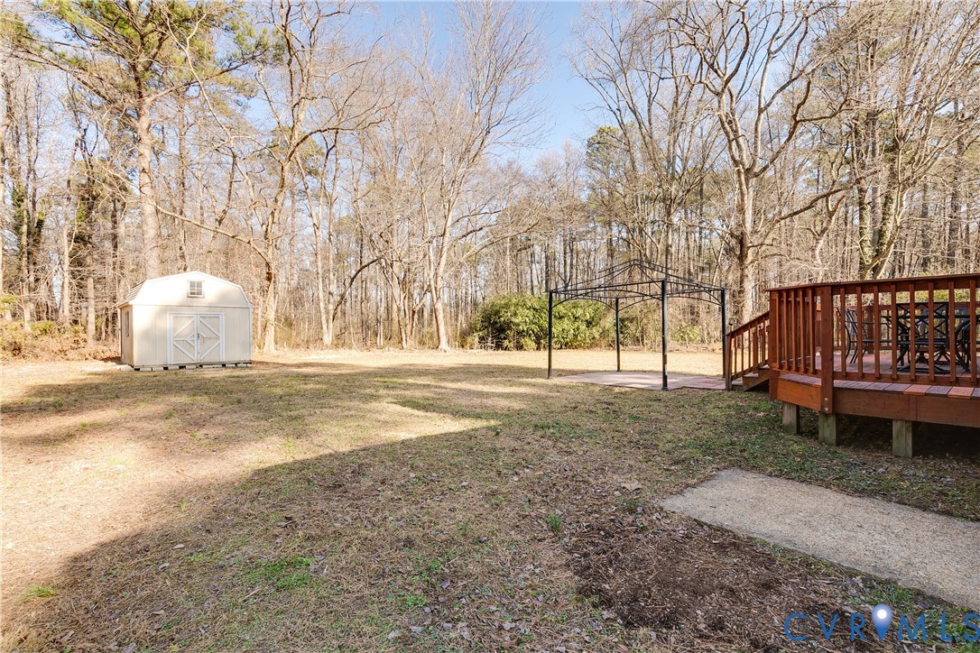 1180 Berryhill Road Henrico, VA 23231 - Photo 19 of 23 a view of outdoor space with deck and trees