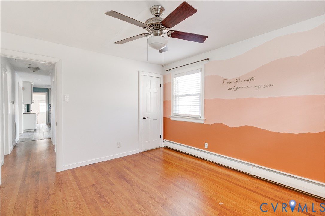1180 Berryhill Road Henrico, VA 23231 - Photo 10 of 23 wooden floor in an empty room with a window