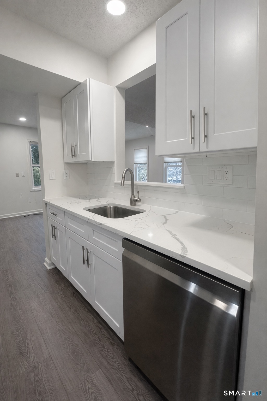 44 Hard Street, Unit 4 New Haven, CT 06515 - Photo 5 of 14 a kitchen with granite countertop white cabinets and a sink