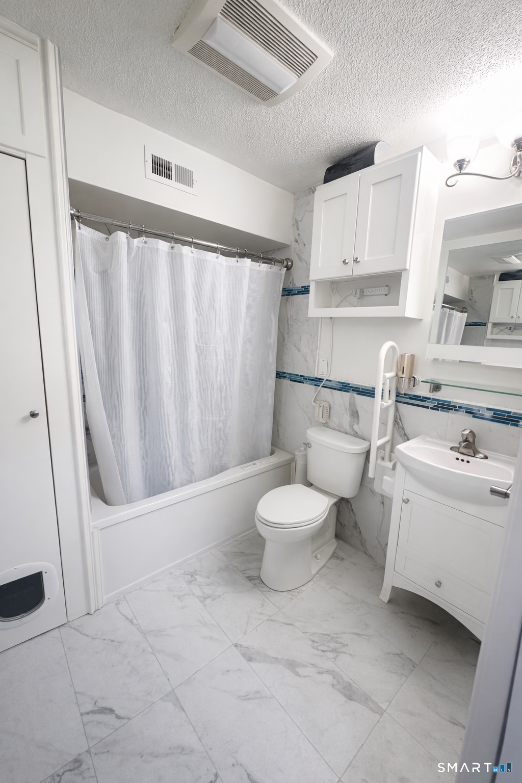 44 Hard Street, Unit 4 New Haven, CT 06515 - Photo 7 of 14 a bathroom with a toilet a sink and a mirror