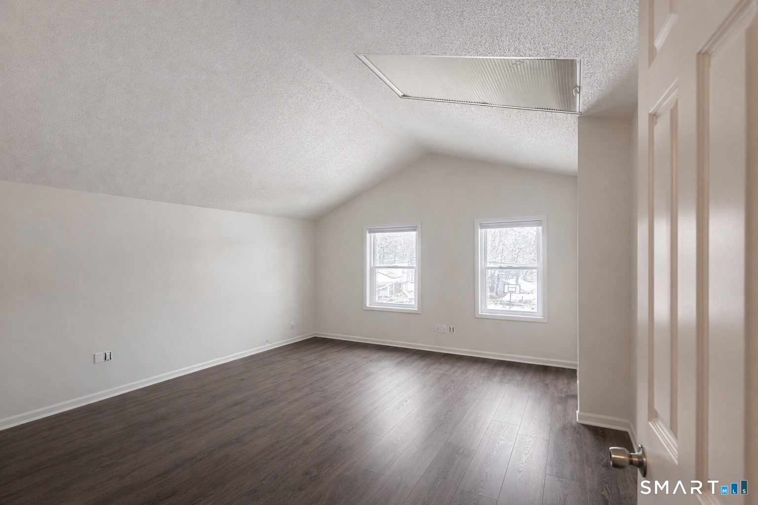 44 Hard Street, Unit 4 New Haven, CT 06515 - Photo 9 of 14 an empty room with wooden floor and windows