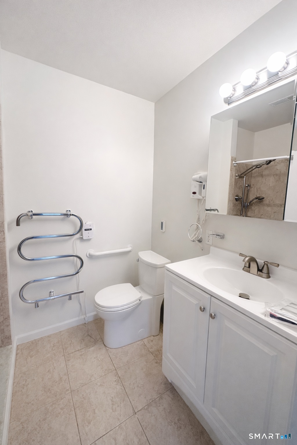 44 Hard Street, Unit 4 New Haven, CT 06515 - Photo 10 of 14 a bathroom with a toilet sink vanity and mirror