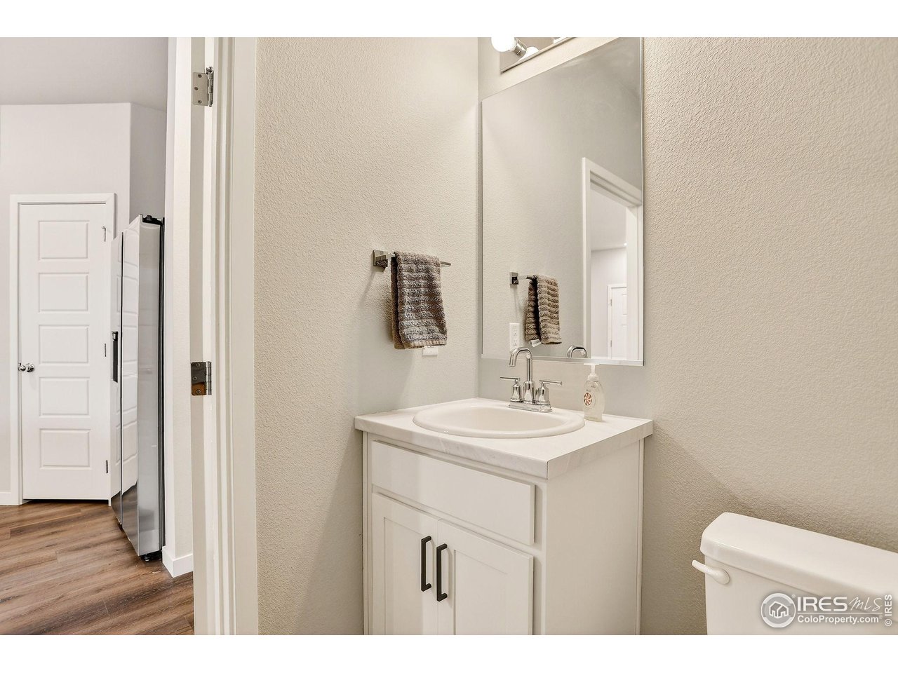 307 Penguin Street Johnstown, CO 80534 - Photo 19 of 34 3/4 bath off of the kitchen