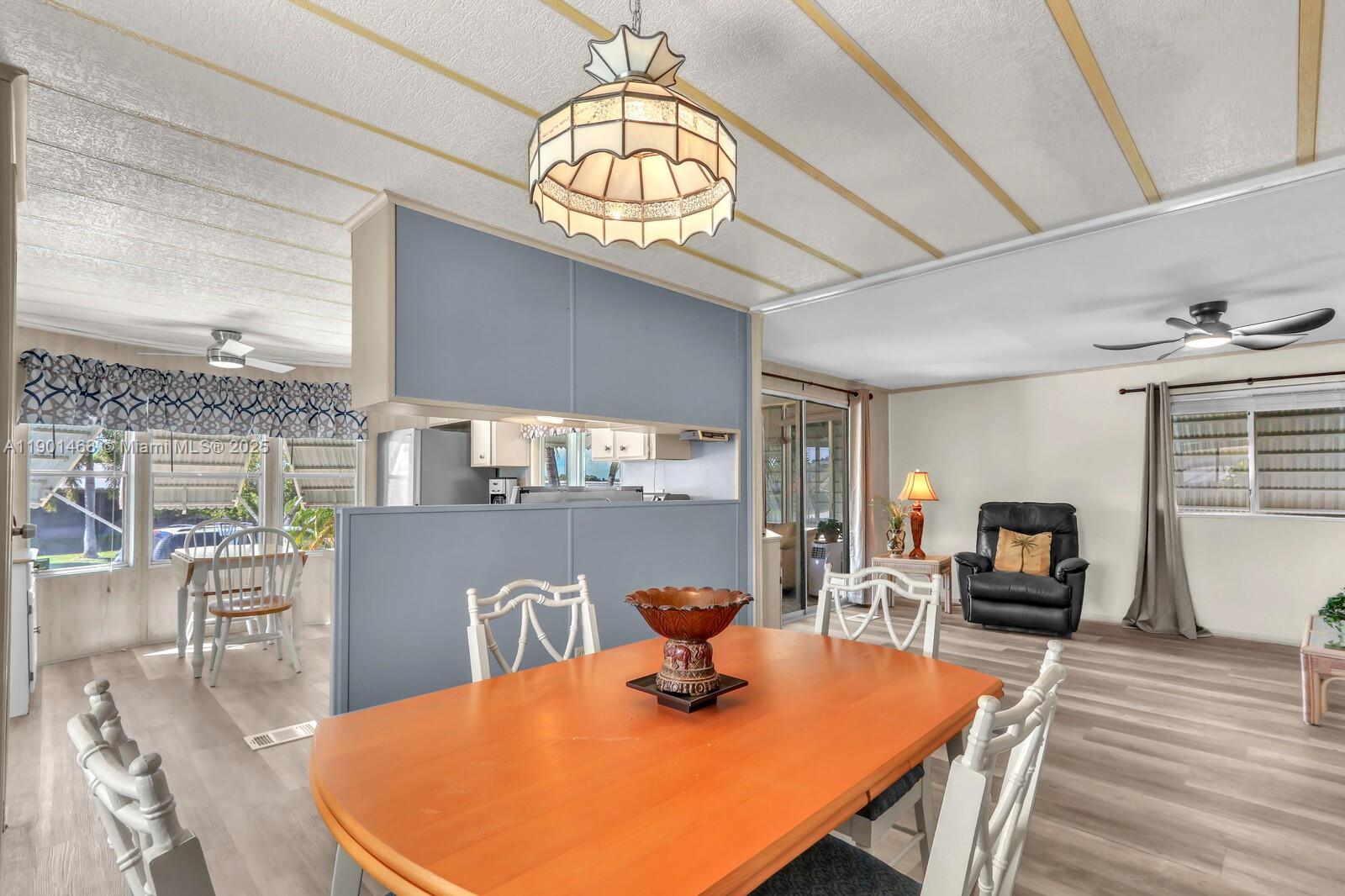 8191 Southeast Homestead Avenue, Unit 8191 Hobe Sound, FL 33455 - Photo 13 of 38 a dining room with furniture and window