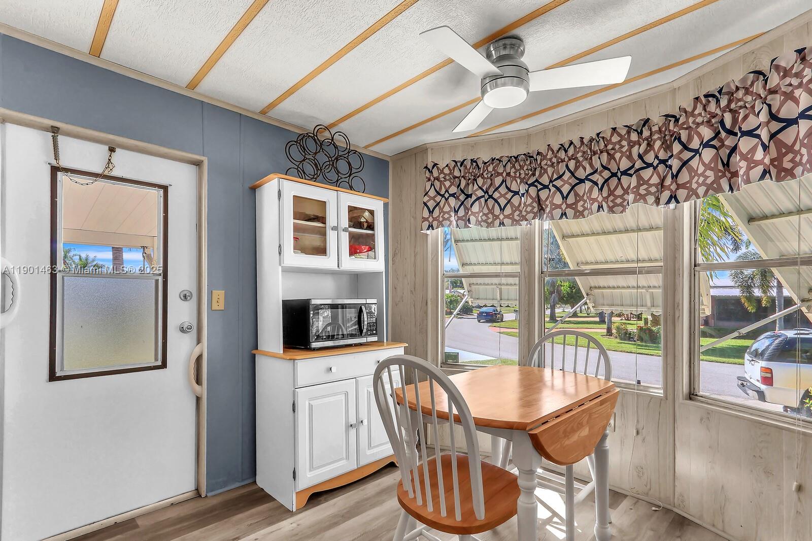8191 Southeast Homestead Avenue, Unit 8191 Hobe Sound, FL 33455 - Photo 16 of 38 a view of a dining room with furniture window and outside view