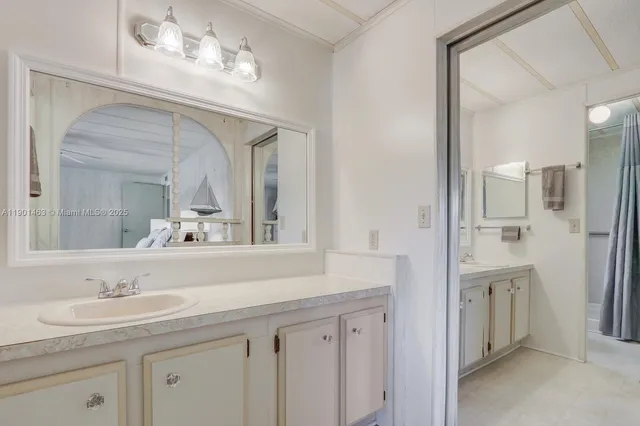 a bathroom with a sink double vanity and a mirror