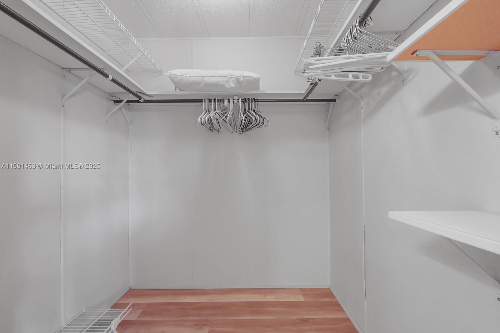 8191 Southeast Homestead Avenue, Unit 8191 Hobe Sound, FL 33455 - Photo 25 of 38 a view of a room with racks on the wall