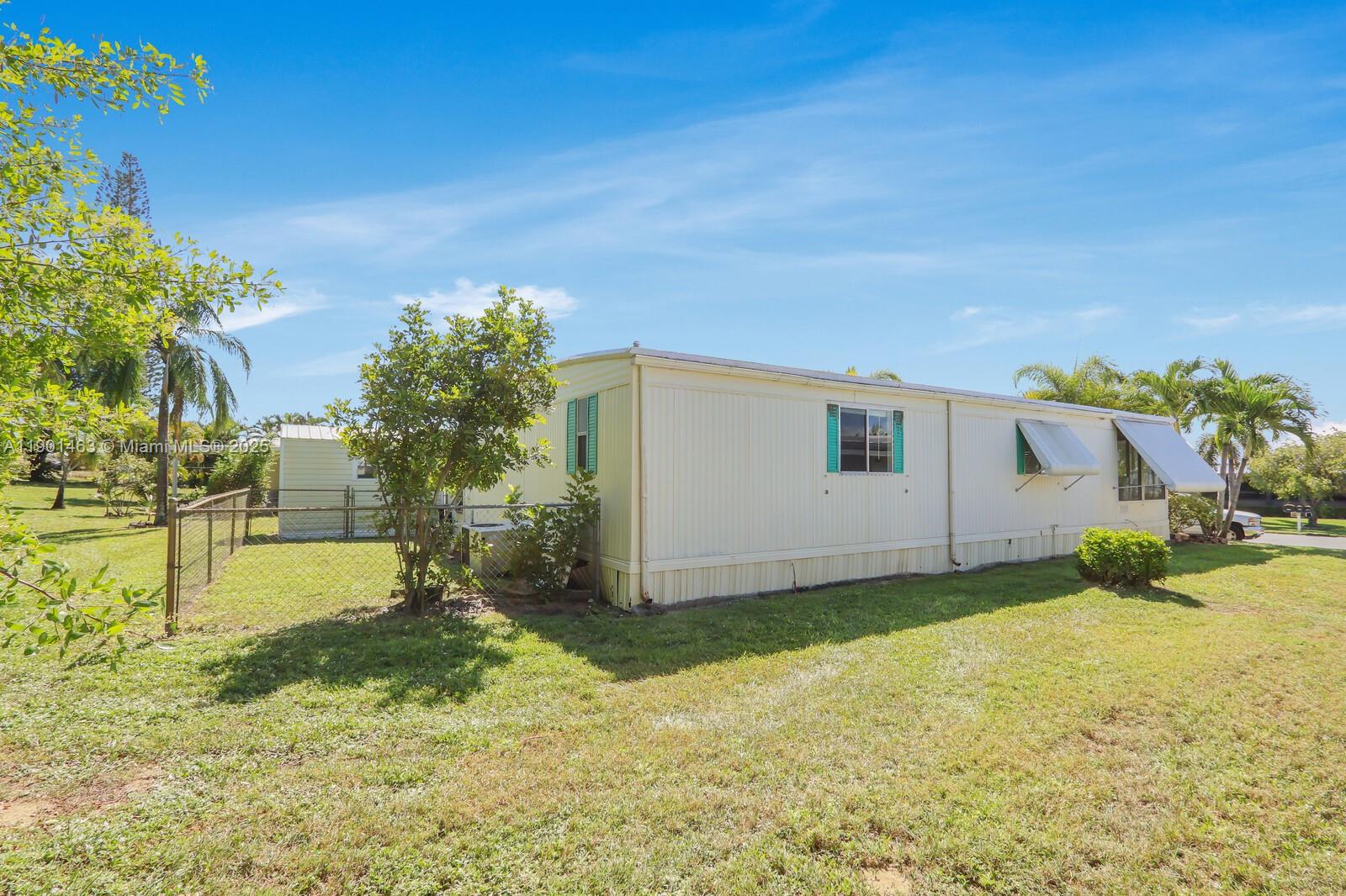 8191 Southeast Homestead Avenue, Unit 8191 Hobe Sound, FL 33455 - Photo 31 of 38 a view of a backyard of the house