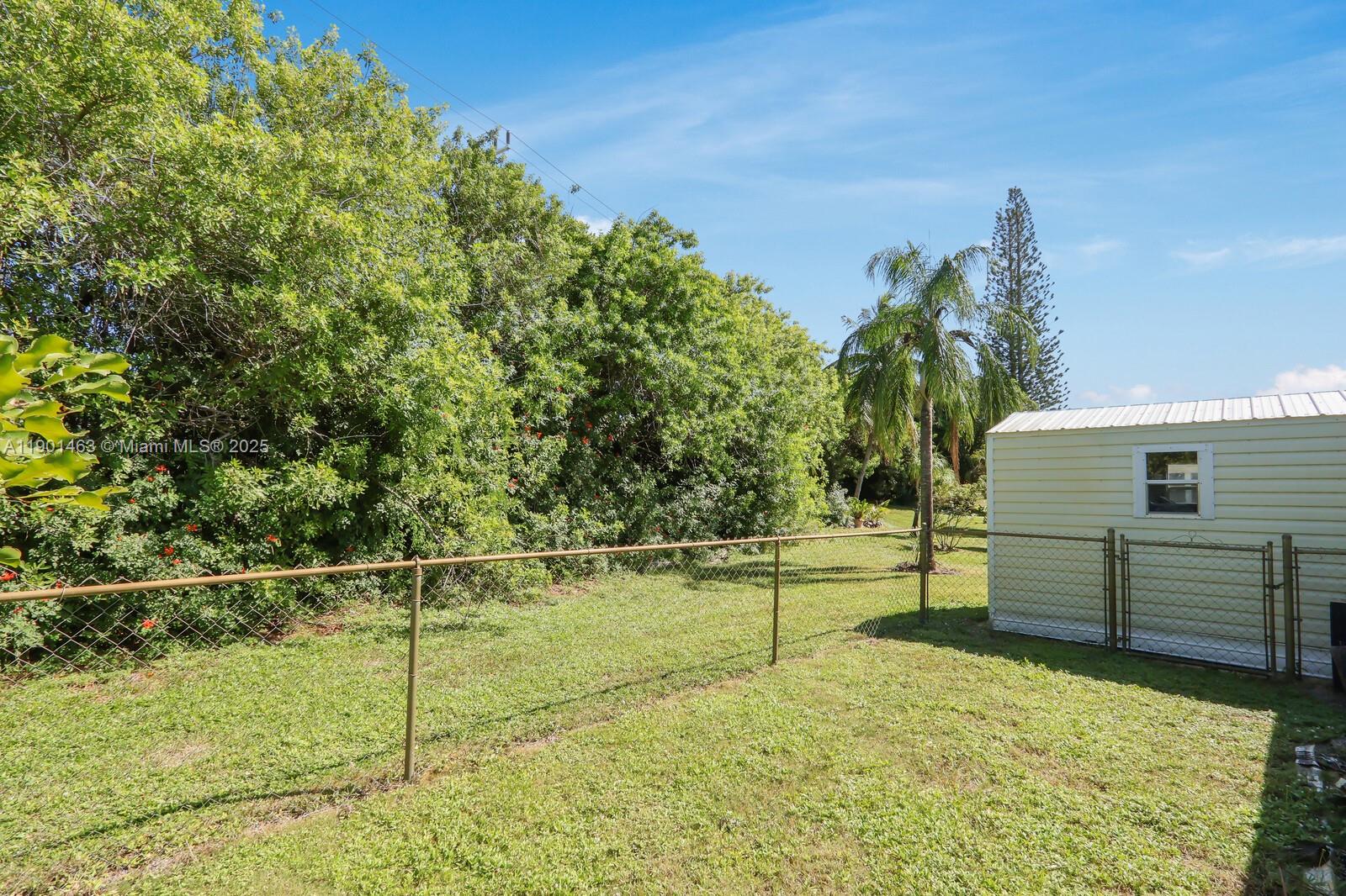 8191 Southeast Homestead Avenue, Unit 8191 Hobe Sound, FL 33455 - Photo 33 of 38 a view of a backyard