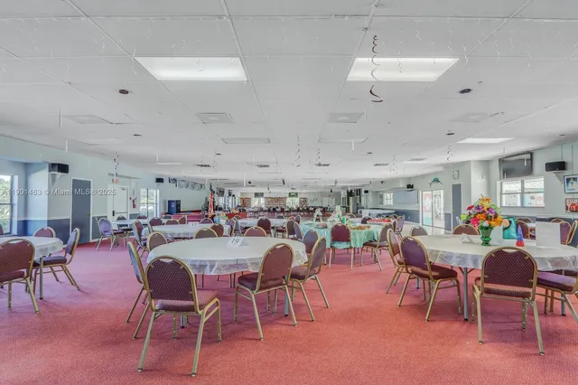a view of a dining area with furniture and a window