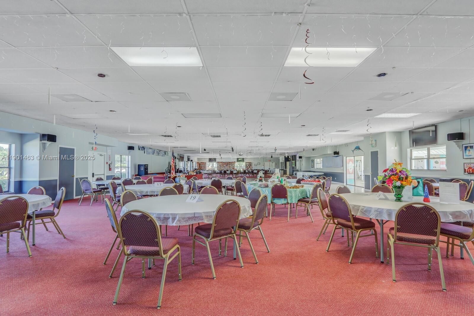 8191 Southeast Homestead Avenue, Unit 8191 Hobe Sound, FL 33455 - Photo 34 of 38 a view of a dining area with furniture and a window