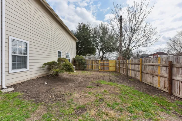 a view of backyard with green space