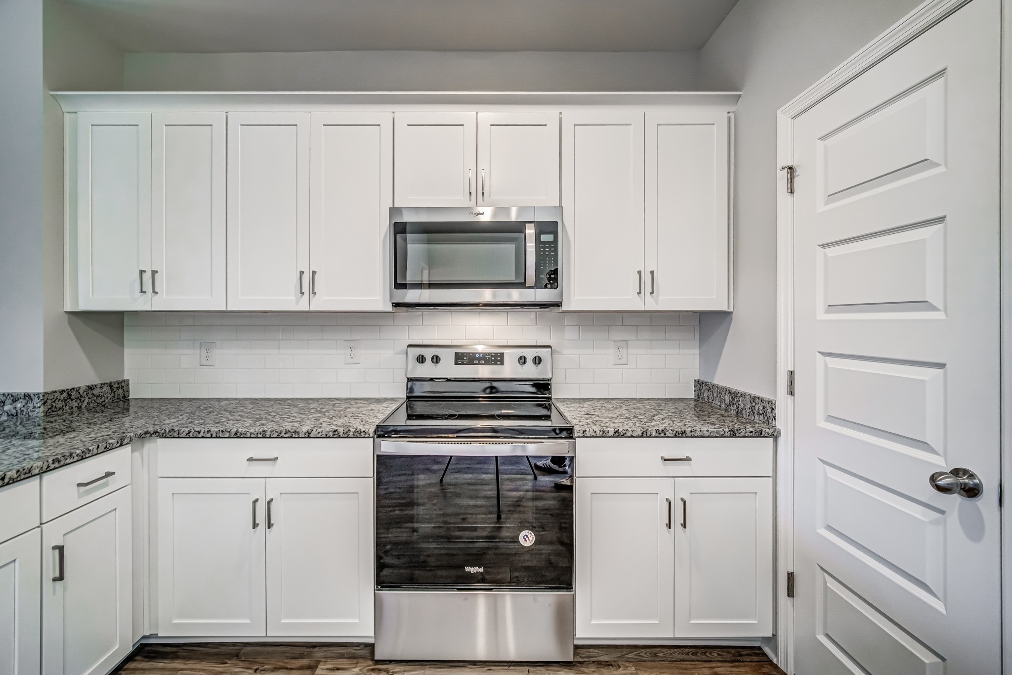 1742 Fenway Loop Antioch, TN 37013 - Photo 13 of 15 a kitchen with granite countertop white cabinets and stainless steel appliances