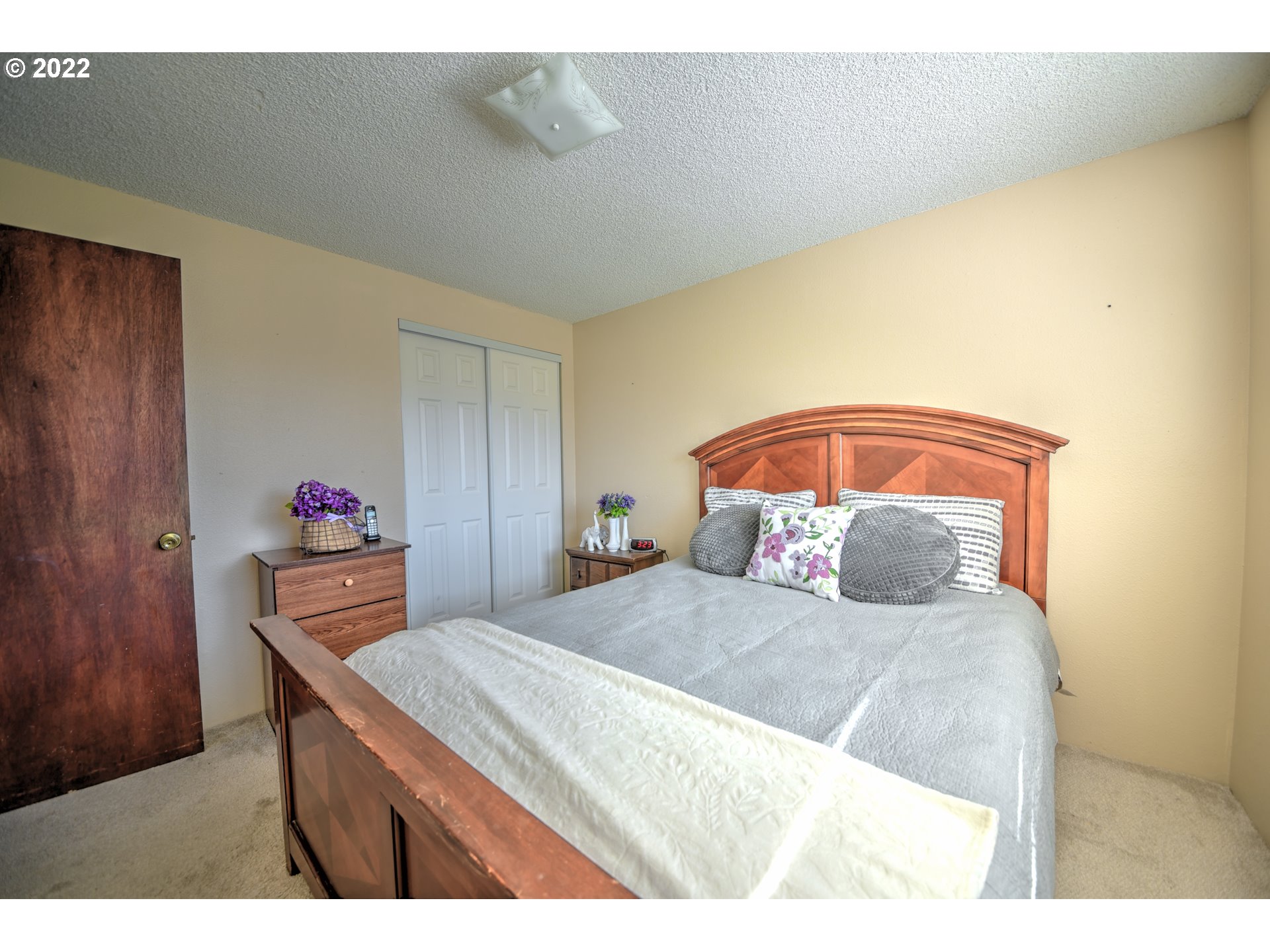 212 72nd Street Springfield, OR 97478 - Photo 11 of 21 a bedroom with a bed and a dresser with wooden floor