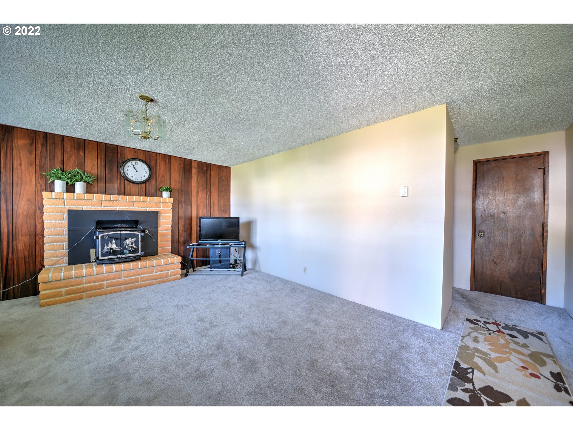 212 72nd Street Springfield, OR 97478 - Photo 4 of 21 a living room with furniture and a fireplace