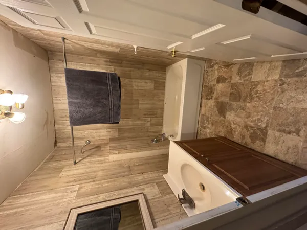a bathroom with a bathtub and shower