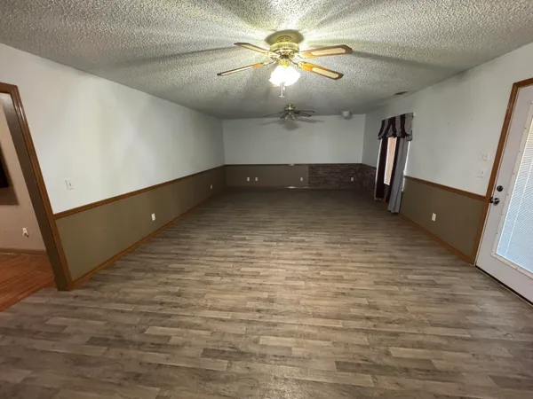a view of a hallway with a microwave