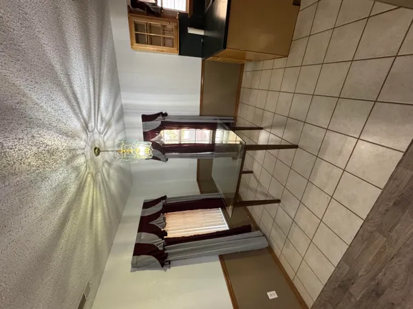 a view of workspace with wooden floor