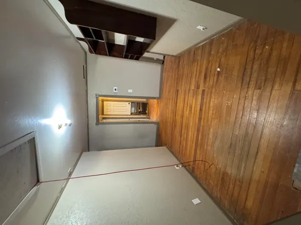 a kitchen with stainless steel appliances granite countertop a sink a stove and a microwave