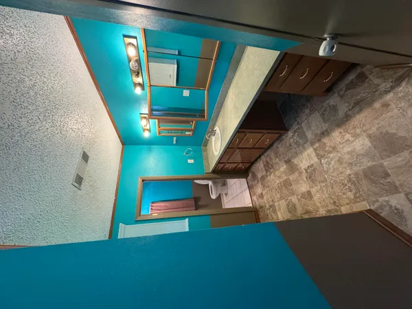 a view of a living room and entryway