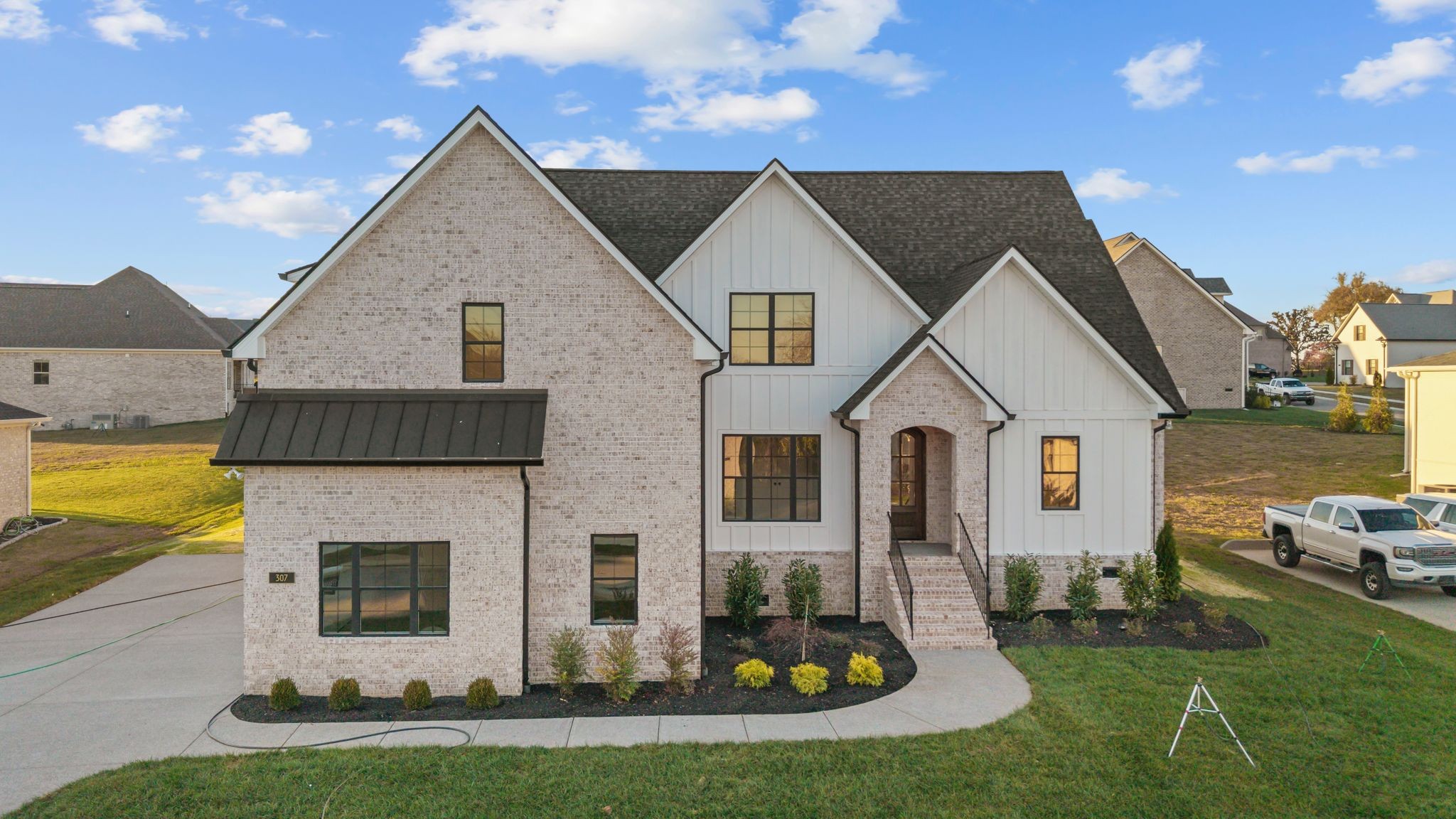 a front view of house with yard and green space