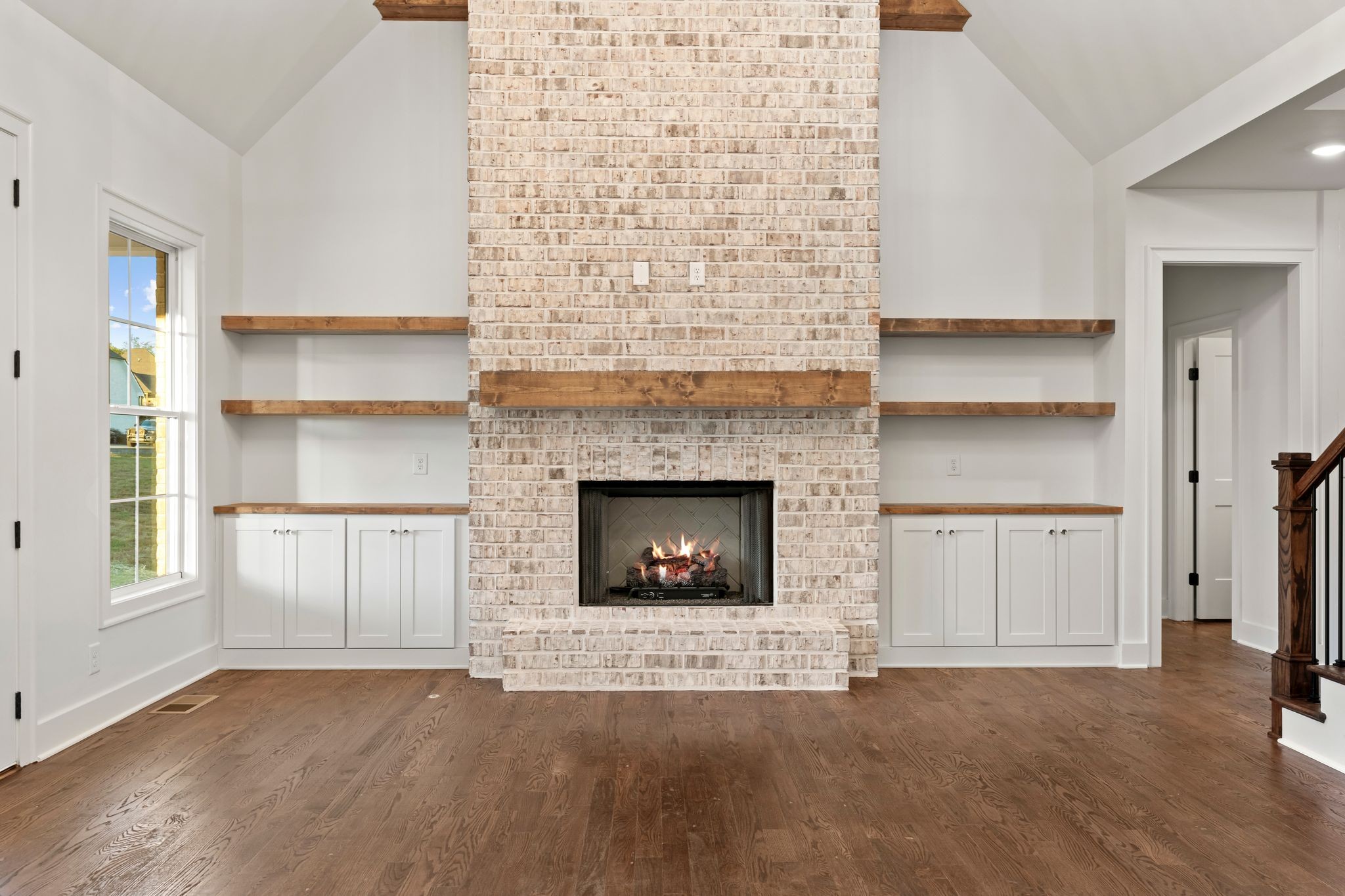 307 Oak Street Lebanon, TN 37087 - Photo 11 of 46 a living room with a fireplace and a floor to ceiling window