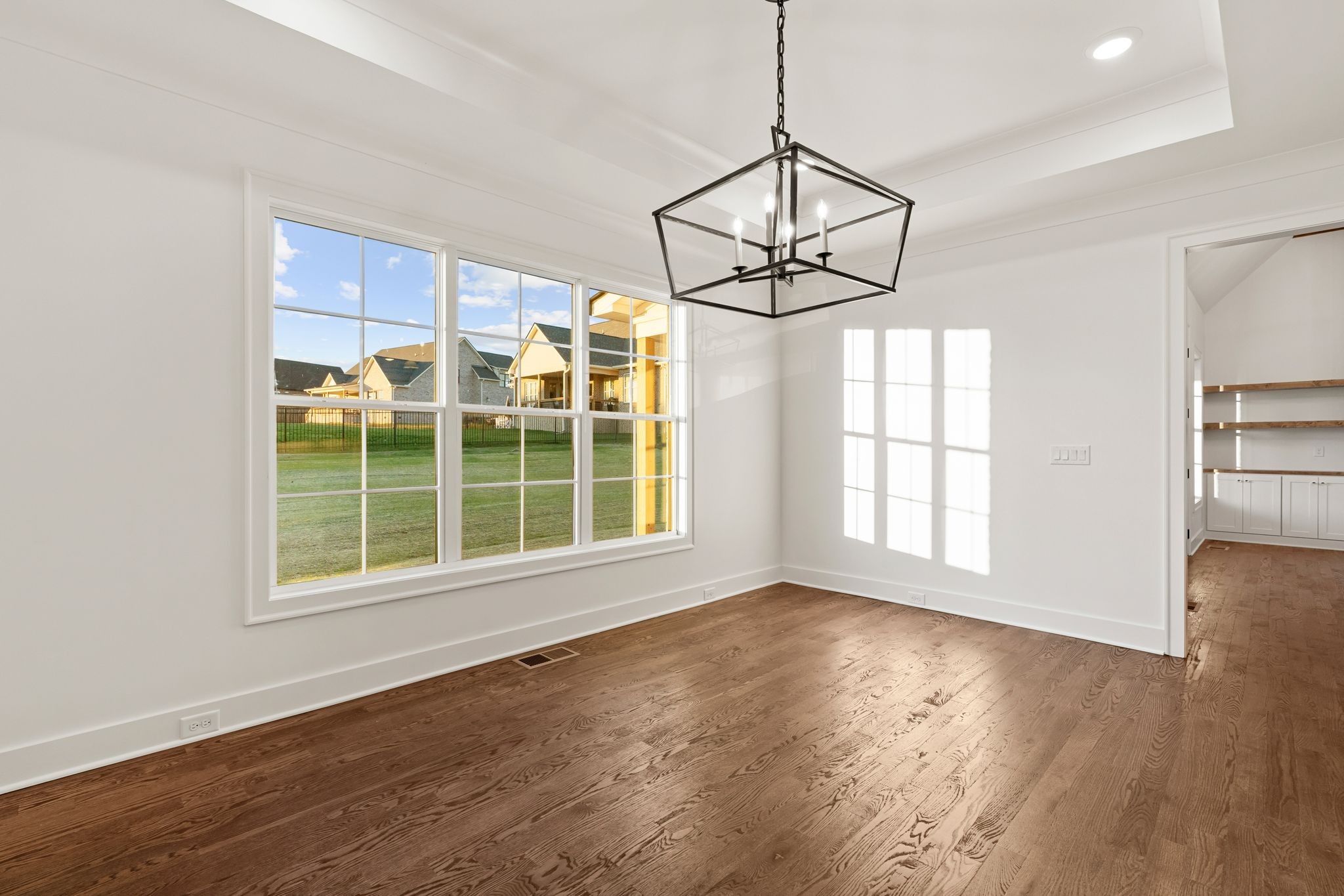 307 Oak Street Lebanon, TN 37087 - Photo 21 of 46 a view of an empty room with wooden floor and windows