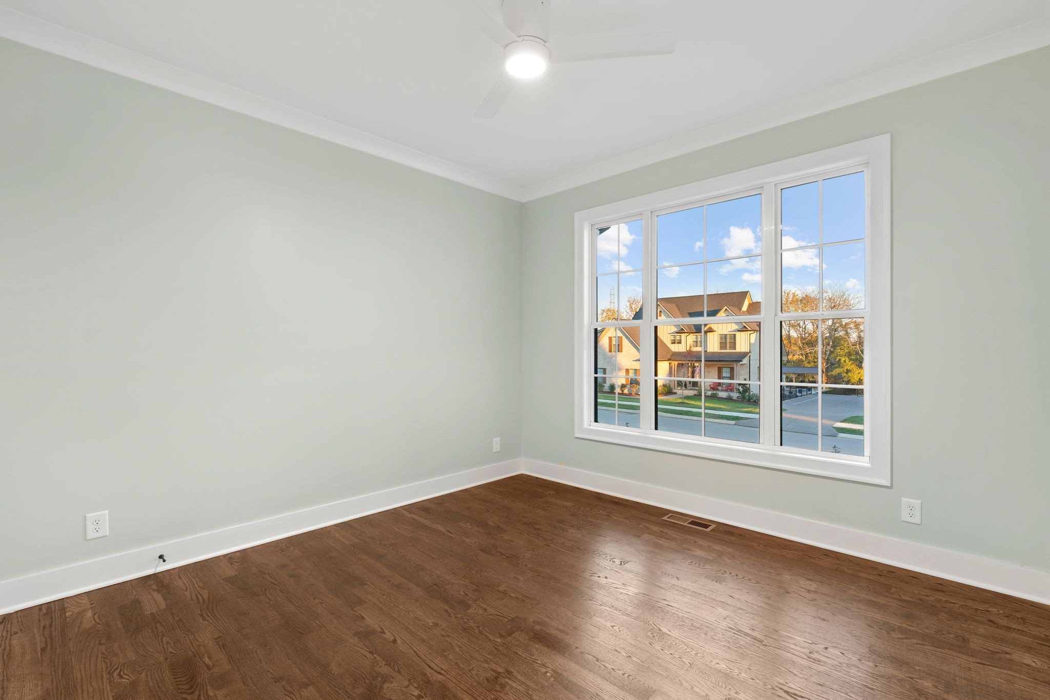307 Oak Street Lebanon, TN 37087 - Photo 23 of 46 an empty room with wooden floor and windows