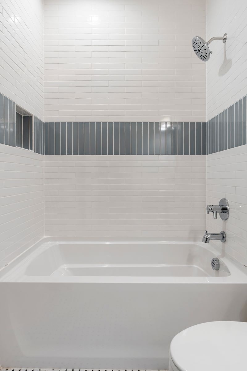 307 Oak Street Lebanon, TN 37087 - Photo 25 of 46 a bathroom with a bathtub and a shower